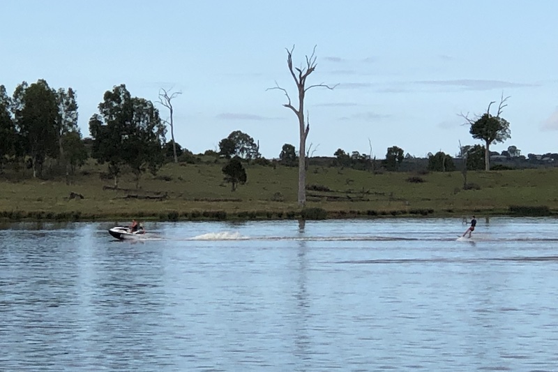 wakeboarding behind a jet ski